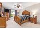 Main bedroom features elegant wooden furniture, neutral walls, and a ceiling fan at 25546 N 164Th Dr, Surprise, AZ 85387