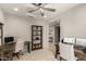 Well-lit home office with dual desks, and view of laundry and entryway at 25546 N 164Th Dr, Surprise, AZ 85387