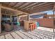 Spacious patio with an outdoor kitchen, pergola, barstool seating and comfortable lounge area at 25546 N 164Th Dr, Surprise, AZ 85387