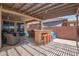 Spacious covered outdoor patio with BBQ, bar, and seating area for entertaining at 25546 N 164Th Dr, Surprise, AZ 85387