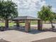 Park pavilion with picnic tables, BBQ, and ample space for outdoor gatherings at 25546 N 164Th Dr, Surprise, AZ 85387