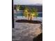 Backyard patio with a view of an inviting pool and palm trees at 25546 N 164Th Dr, Surprise, AZ 85387