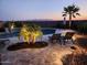 Backyard patio with comfortable lounge chairs and a view of an inviting pool and surrounding foliage at 25546 N 164Th Dr, Surprise, AZ 85387