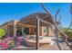 Outdoor patio with pergola, pavers, seating, desert landscaping, and views of community at 26333 W Vista North Dr, Buckeye, AZ 85396