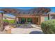 Outdoor patio with pergola, pavers, seating, desert landscaping, and views of community at 26333 W Vista North Dr, Buckeye, AZ 85396