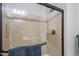 A spacious walk-in shower featuring a built-in shower seat and modern fixtures at 26333 W Vista North Dr, Buckeye, AZ 85396