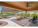 Inviting covered patio with a ceiling fan, outdoor seating, and a decorative pergola at 26333 W Vista North Dr, Buckeye, AZ 85396