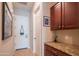 Entryway featuring granite countertop, cabinets, and tile flooring at 26333 W Vista North Dr, Buckeye, AZ 85396