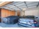 Spacious garage featuring built in storage cabinets, and parked vehicles at 26333 W Vista North Dr, Buckeye, AZ 85396