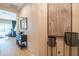 Inviting hallway showcasing decorative elements such as plants, wall decor, and stylish furniture at 26333 W Vista North Dr, Buckeye, AZ 85396