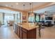 Spacious kitchen with a large island featuring granite countertops and seating at 26333 W Vista North Dr, Buckeye, AZ 85396