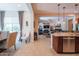 Open-concept space showcasing the gourmet kitchen with stainless steel appliances and a comfortable living area at 26333 W Vista North Dr, Buckeye, AZ 85396
