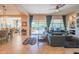 Open-concept living room with large window, tile floors, and views of the backyard patio at 26333 W Vista North Dr, Buckeye, AZ 85396