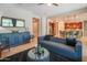 Stylish living room flowing into a modern kitchen, featuring sleek furnishings and great for entertaining at 26333 W Vista North Dr, Buckeye, AZ 85396
