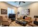 A welcoming living room with plush carpet, stylish furniture, and natural light at 26333 W Vista North Dr, Buckeye, AZ 85396