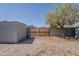 Backyard gate and privacy fence with trees visible at 2853 W Ohio St, Apache Junction, AZ 85120