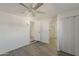 Spacious bedroom with wood floors, ceiling fan, and ensuite bathroom with glass shower at 2853 W Ohio St, Apache Junction, AZ 85120
