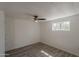 This bedroom has wood-look flooring, white walls and a ceiling fan at 2853 W Ohio St, Apache Junction, AZ 85120