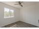 This bedroom has wood-look flooring, white walls and a ceiling fan at 2853 W Ohio St, Apache Junction, AZ 85120