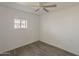 This bedroom has wood-look flooring, white walls and a ceiling fan at 2853 W Ohio St, Apache Junction, AZ 85120