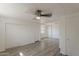 This bedroom features wood-look flooring, and access to multiple closets at 2853 W Ohio St, Apache Junction, AZ 85120
