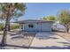 Charming single-story home featuring desert landscaping and a long private driveway at 2853 W Ohio St, Apache Junction, AZ 85120