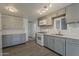 Modern kitchen with stainless steel appliances, sleek countertops, and ample cabinet space at 2853 W Ohio St, Apache Junction, AZ 85120