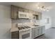 Well-lit kitchen featuring updated appliances and contemporary cabinetry, ideal for cooking at 2853 W Ohio St, Apache Junction, AZ 85120