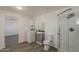 Laundry area with washer, dryer, sink, and shower visible from the bedroom at 2853 W Ohio St, Apache Junction, AZ 85120