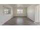 Bright and airy living room with modern floors and large windows, offering ample natural light at 2853 W Ohio St, Apache Junction, AZ 85120