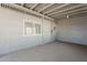 Enclosed patio shows cement flooring and walls with 2 windows at 2853 W Ohio St, Apache Junction, AZ 85120
