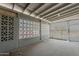 Enclosed patio shows cement flooring, geometric cutouts, and a screen door at 2853 W Ohio St, Apache Junction, AZ 85120