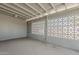 Enclosed patio shows cement flooring and walls with geometric cutouts at 2853 W Ohio St, Apache Junction, AZ 85120