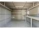 Bright storage shed interior with pegboard wall and shelves at 2853 W Ohio St, Apache Junction, AZ 85120