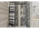 Close-up of an updated shower with gray and white marble-look tile at 2853 W Ohio St, Apache Junction, AZ 85120