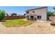 A well-kept backyard with grass, a patio, grilling area and neutral gravel at 2963 S 83Rd St, Mesa, AZ 85212