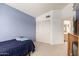 Blue bedroom with closet, twin bed, and neutral carpet at 2963 S 83Rd St, Mesa, AZ 85212