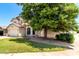 Charming two-story home featuring a well-maintained front yard and attached two-car garage on a sunny day at 2963 S 83Rd St, Mesa, AZ 85212