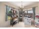 This kitchen area features a stainless steel mini-fridge, shelving, and large bright windows at 2963 S 83Rd St, Mesa, AZ 85212