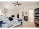 This main bedroom has a ceiling fan, access to the main bathroom, and large windows at 2963 S 83Rd St, Mesa, AZ 85212