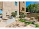 Backyard featuring a built-in grill and patio area, complemented by lush greenery at 312 S Hardy Dr # 106, Tempe, AZ 85281