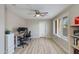Home office with a ceiling fan, a desk with monitors and ample natural light at 312 S Hardy Dr # 106, Tempe, AZ 85281