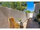 Private patio with brick flooring, mature landscaping, and a seating area at 312 S Hardy Dr # 106, Tempe, AZ 85281