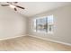 Bright bedroom with a ceiling fan, tiled floor, and a window view of the neighborhood at 3622 W Barcelona Dr, Chandler, AZ 85226
