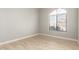 Bright bedroom featuring tile floors, a large arched window, and neutral-colored walls at 3622 W Barcelona Dr, Chandler, AZ 85226