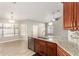 Kitchen featuring granite countertops, stainless steel appliances, and adjacent breakfast nook with bright windows at 3622 W Barcelona Dr, Chandler, AZ 85226