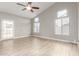 Bright and airy living room with multiple windows, ceiling fan, and easy access to the outdoor area at 3622 W Barcelona Dr, Chandler, AZ 85226