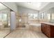 Elegant bathroom with tile floors, a corner soaking tub, a walk-in shower, and a vanity with granite countertop at 3622 W Barcelona Dr, Chandler, AZ 85226