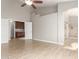 Spacious main bedroom with tile floors, high ceilings, and a doorway to an ensuite bathroom at 3622 W Barcelona Dr, Chandler, AZ 85226