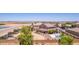 Lovely aerial view of home showcasing backyard pool, desert landscaping and other homes at 36645 W Bilbao St, Maricopa, AZ 85138